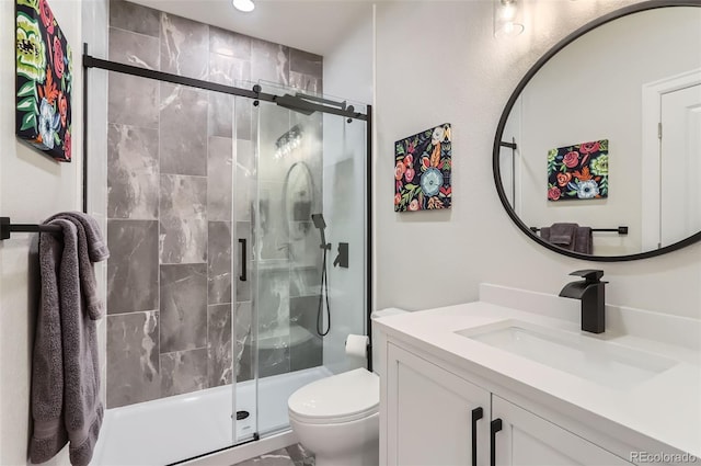 full bathroom featuring a stall shower, vanity, toilet, and recessed lighting