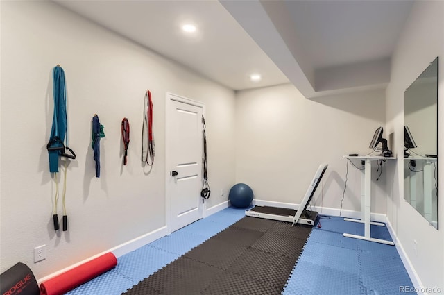 workout room with recessed lighting and baseboards