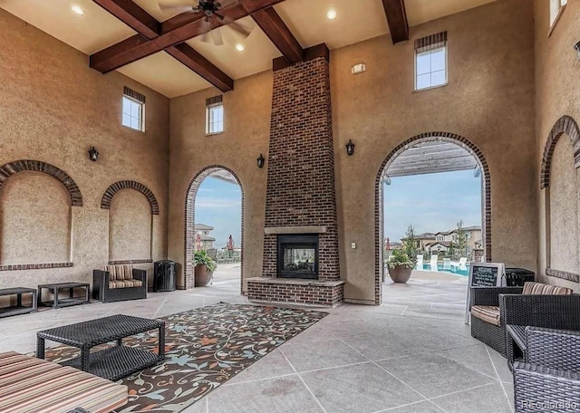 view of patio / terrace featuring an outdoor brick fireplace