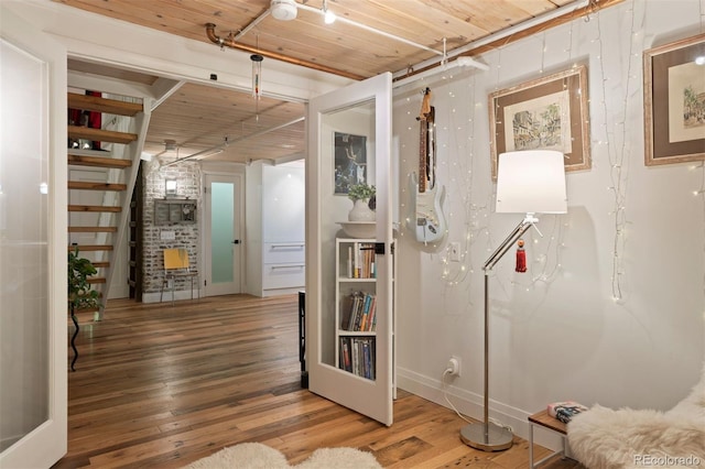 interior space featuring wood ceiling and hardwood / wood-style flooring