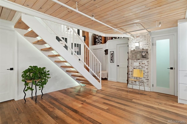 interior space featuring hardwood / wood-style floors and wood ceiling