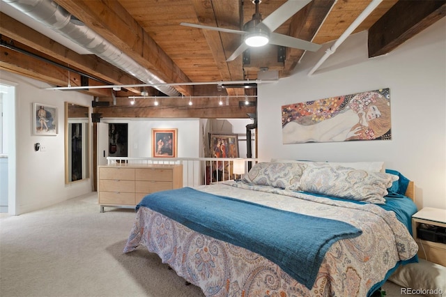 carpeted bedroom with rail lighting, ceiling fan, wooden ceiling, and beamed ceiling