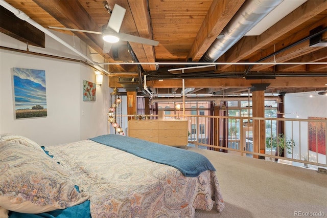 bedroom featuring wooden ceiling, carpet, and beam ceiling