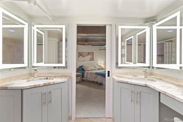 bathroom with tile patterned flooring and vanity