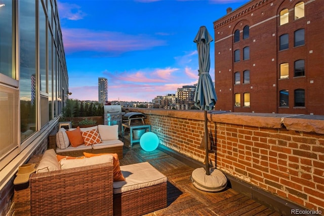 deck at dusk with an outdoor hangout area