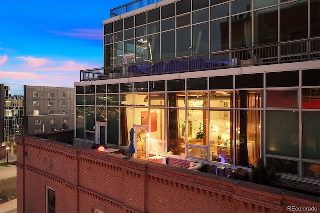 view of outdoor building at dusk