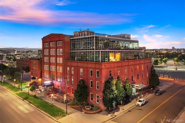 view of outdoor building at dusk