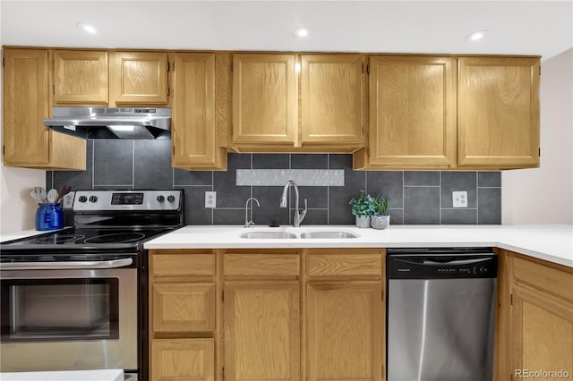 5955 E 10th Ave Unit 201, Denver, CO 80220 - kitchen with appliances with stainless steel finishes, under cabinet range hood, light countertops, tasteful backsplash, and recessed lighting