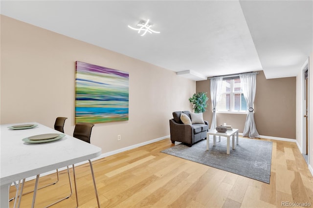 5955 E 10th Ave Unit 201, Denver, CO 80220 - living area with light wood-type flooring and baseboards