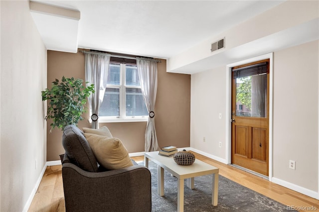 5955 E 10th Ave Unit 201, Denver, CO 80220 - sitting room featuring baseboards and light wood-style floors