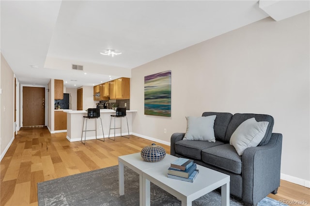 5955 E 10th Ave Unit 201, Denver, CO 80220 - living area featuring light wood-style floors