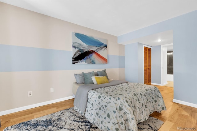 5955 E 10th Ave Unit 201, Denver, CO 80220 - bedroom with wood finished floors and a closet