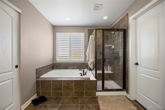 full bath with a shower stall, a garden tub, visible vents, and tile patterned floors