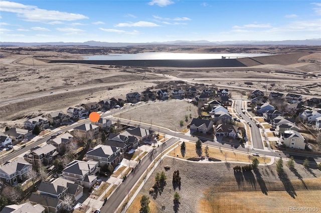 aerial view with a residential view and a water and mountain view