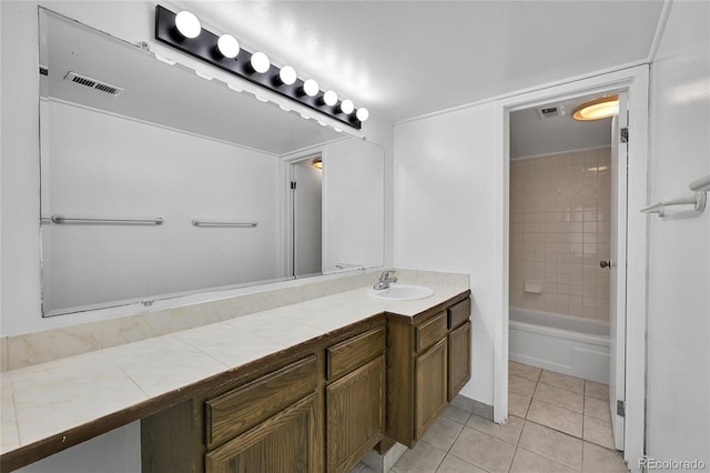 9700 E Iliff Ave Unit D44, Denver, CO 80231 - full bath featuring vanity, tile patterned floors, and bathing tub / shower combination