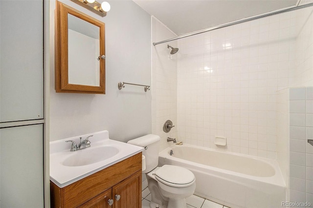full bathroom featuring toilet, tile patterned floors, vanity, and shower / tub combination
