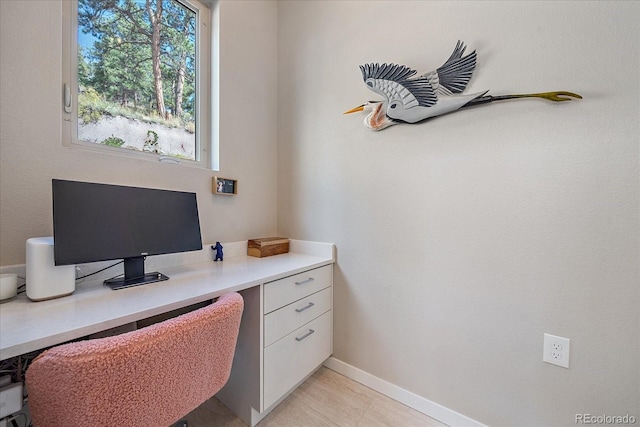 office space with light tile patterned floors