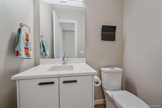 756 Dreamcatcher Ln, Evergreen, CO 80439 - half bathroom featuring toilet and vanity