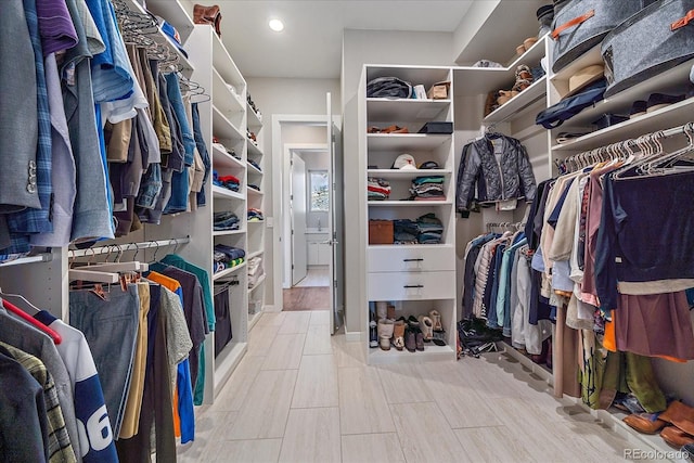 walk in closet featuring light hardwood / wood-style floors