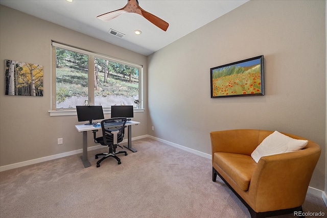 office space featuring ceiling fan and light carpet