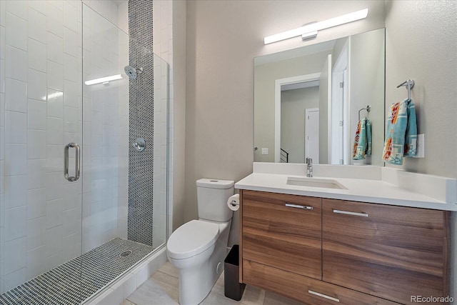 756 Dreamcatcher Ln, Evergreen, CO 80439 - bathroom with toilet, a stall shower, vanity, and tile patterned flooring