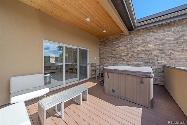 deck featuring a hot tub