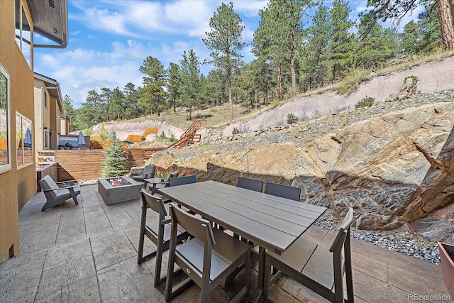 view of patio with an outdoor fire pit