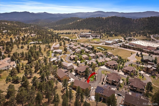 birds eye view of property featuring a mountain view