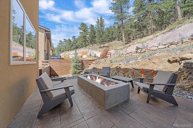 756 Dreamcatcher Ln, Evergreen, CO 80439 - view of patio / terrace with an outdoor fire pit