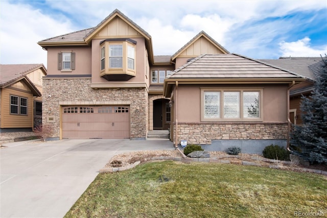 view of front of property featuring a garage and a front lawn