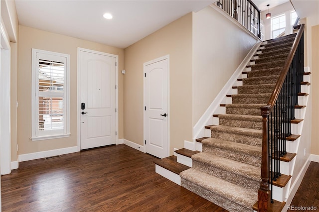 entrance foyer with dark hardwood / wood-style flooring