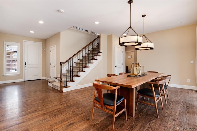 dining area with dark hardwood / wood-style floors