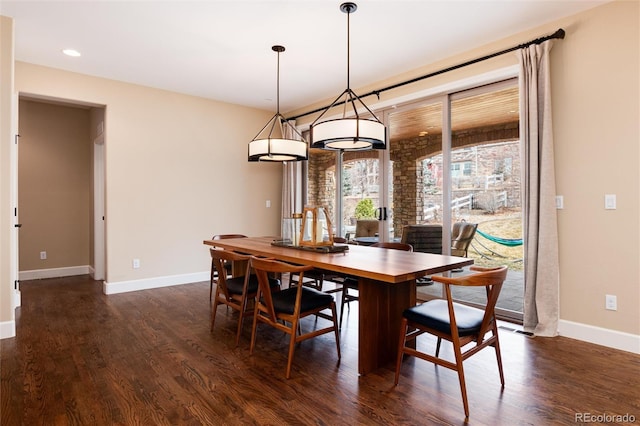 dining area featuring dark hardwood / wood-style flooring