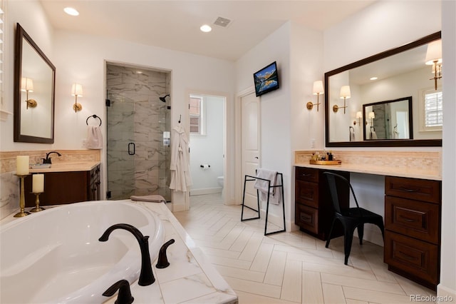 full bathroom with parquet flooring, vanity, toilet, and independent shower and bath