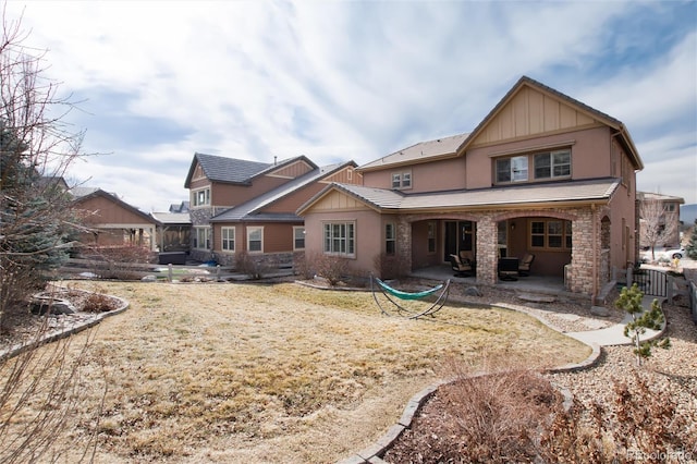 back of house featuring a patio area