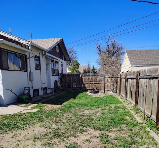 view of yard with a fenced backyard