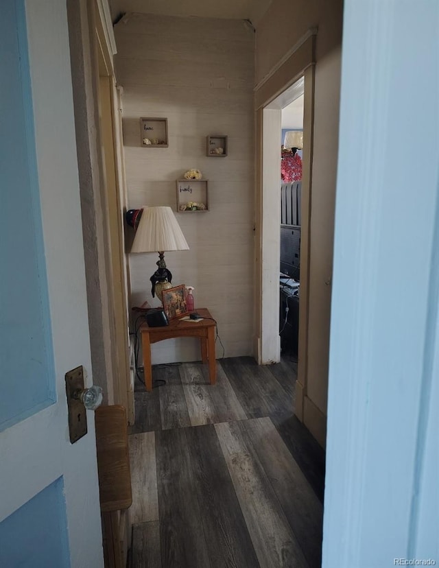 corridor featuring wood finished floors