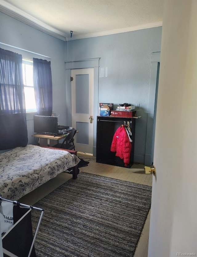 bedroom with ornamental molding