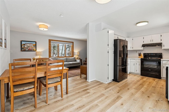 dining area featuring light wood-style flooring