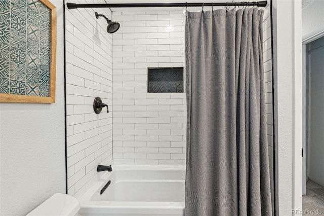 full bathroom featuring toilet and shower / bath combo with shower curtain