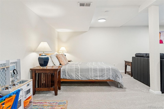 carpeted bedroom with baseboards and visible vents