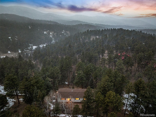 mountain view with a wooded view