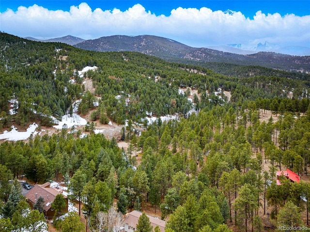 aerial view with a mountain view and a view of trees