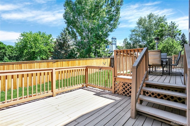 9682 Hemlock Ct, Highlands Ranch, CO 80130 - deck featuring a fenced backyard and outdoor dining space