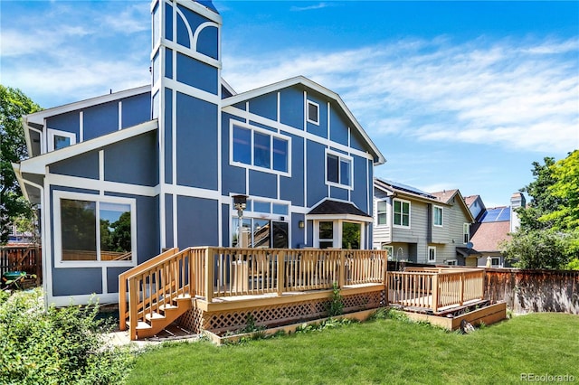 9682 Hemlock Ct, Highlands Ranch, CO 80130 - back of house with a deck and stucco siding