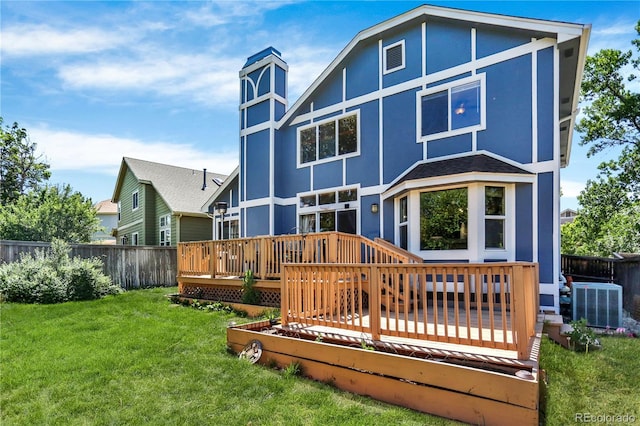 9682 Hemlock Ct, Highlands Ranch, CO 80130 - back of house with a wooden deck, a fenced backyard, and stucco siding