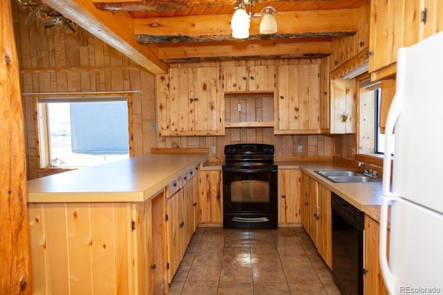 kitchen with beamed ceiling, sink, dark tile floors, and black appliances