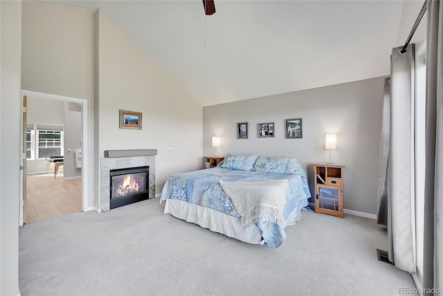 31324 Kings Vly, Conifer, CO 80433 - carpeted bedroom with high vaulted ceiling, baseboards, a fireplace, and ceiling fan