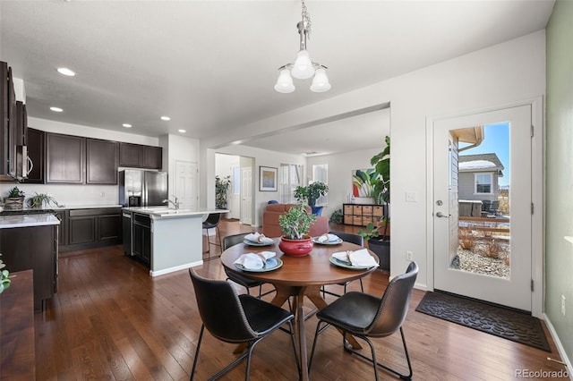 dining space with dark wood-type flooring