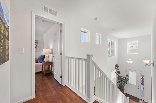 hallway featuring dark hardwood / wood-style flooring